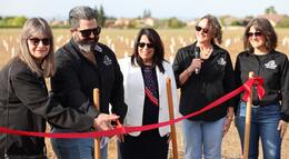 Photo of ribbon cutting at new cherry orchard