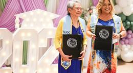 Photo of mother and daughter graduating from College