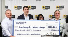 Photo of Congressman Josh Harder presenting a check to Delta College