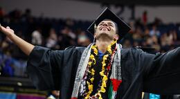 Photo of a student celebrating at Commencement