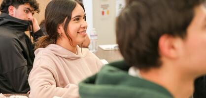 A student smiles during her speech class