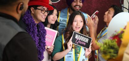 Students pose at a Delta College photo booth