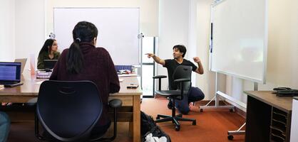 A tutor works with students at one of Delta College's learning labs.