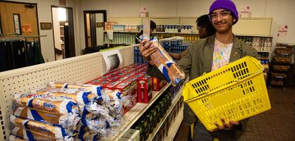 Photo of a student getting bread at the Student Food Pantry