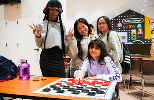 Photo of students playing checkers during a break