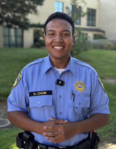 Portrait of POST Academy student wearing uniform smiling outside