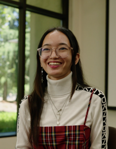Portrait of student sitting in front of a window