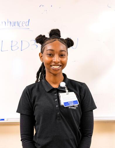 Delta College Psychiatric Technician student smiling in a classroom