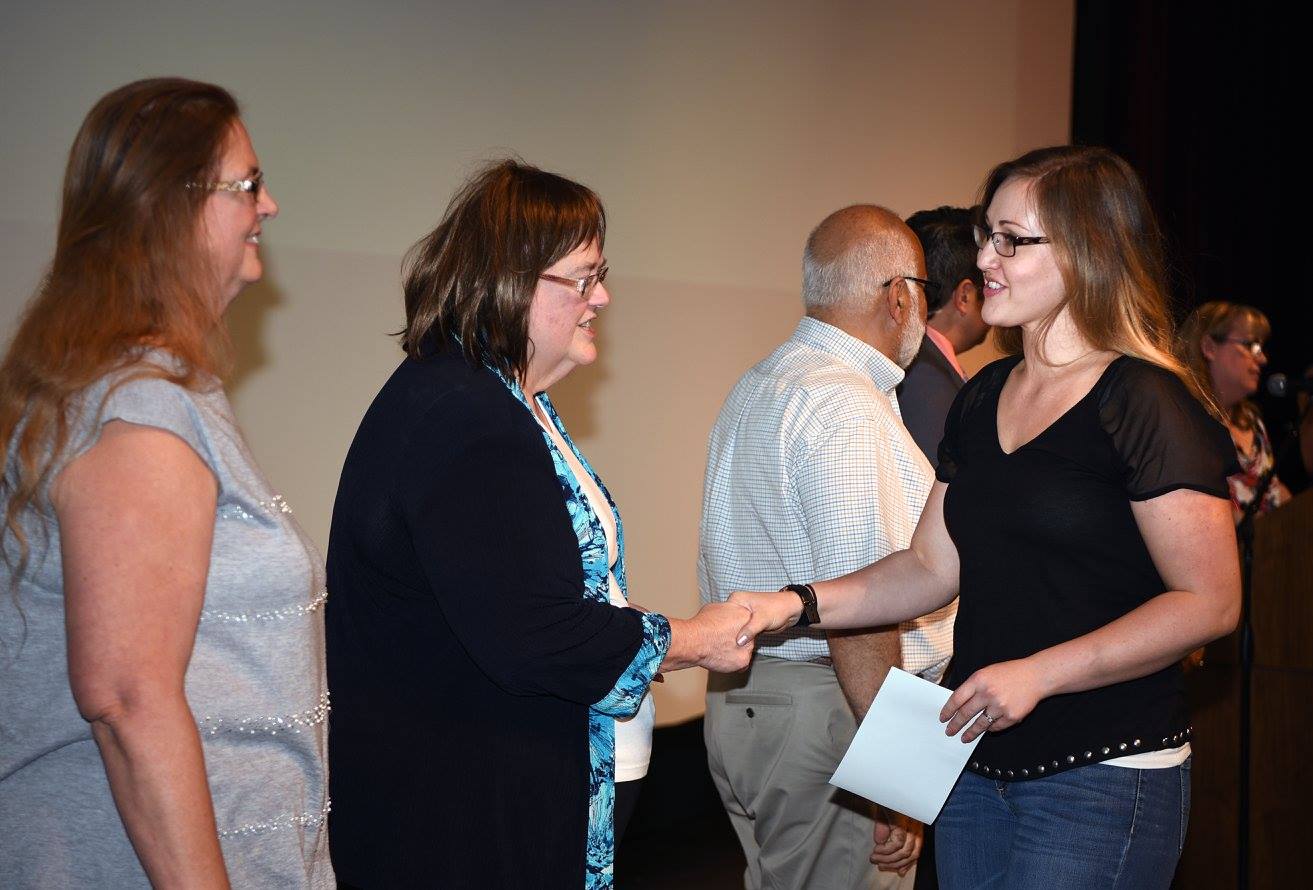 Trustee Teresa Brown greets a scholarship winner